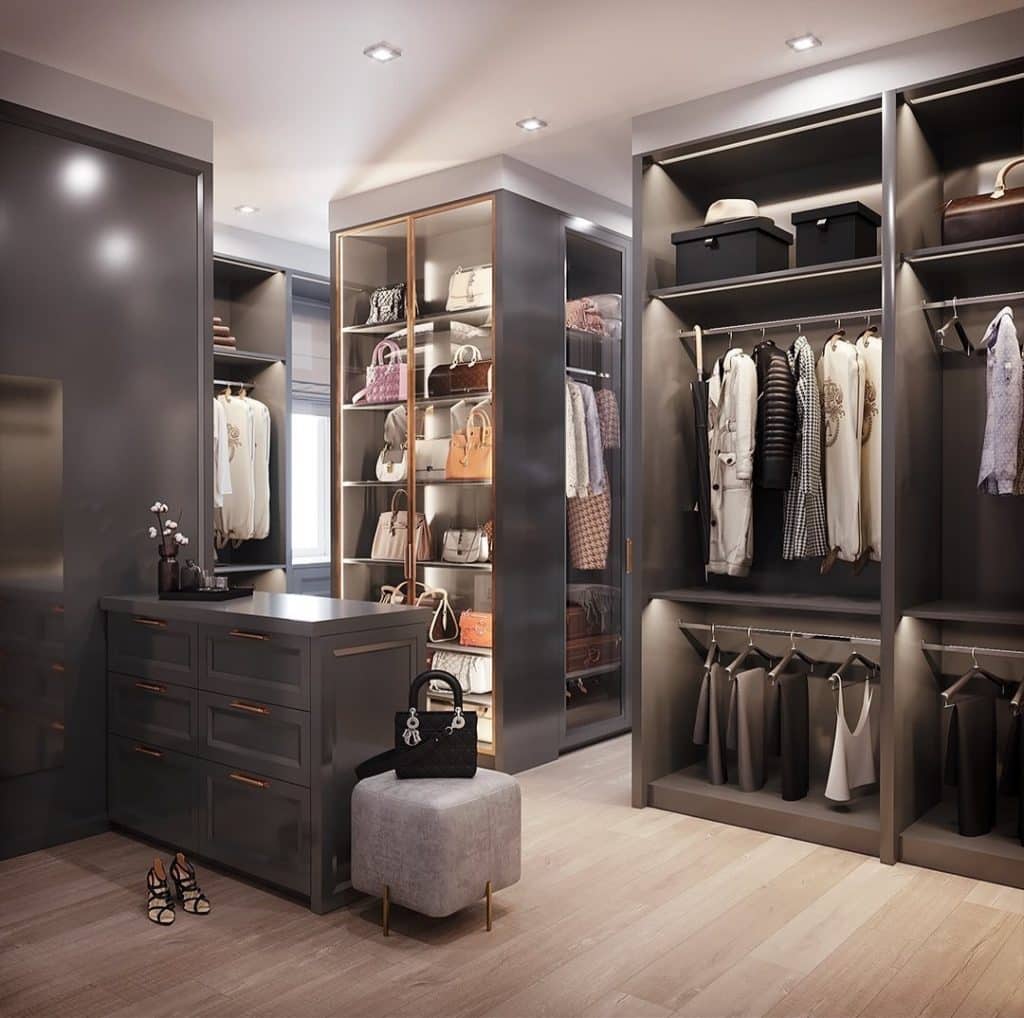 Mr. Wardrobe's bespoke walk-in closet in London, filled with a vast collection of clothes and shoes.