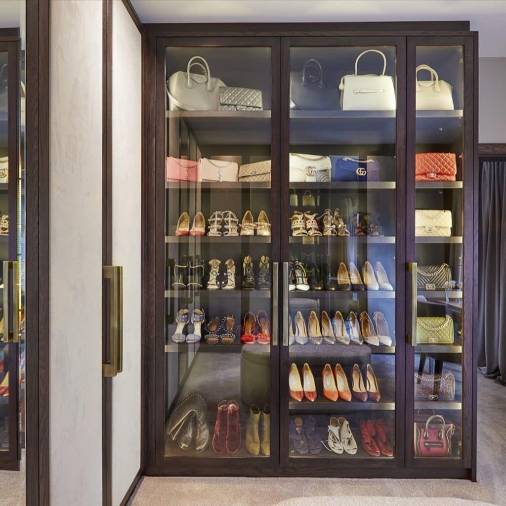 Mr. Wardrobe's bespoke walk-in closet in London boasts an impressive collection of shoes and purses.
