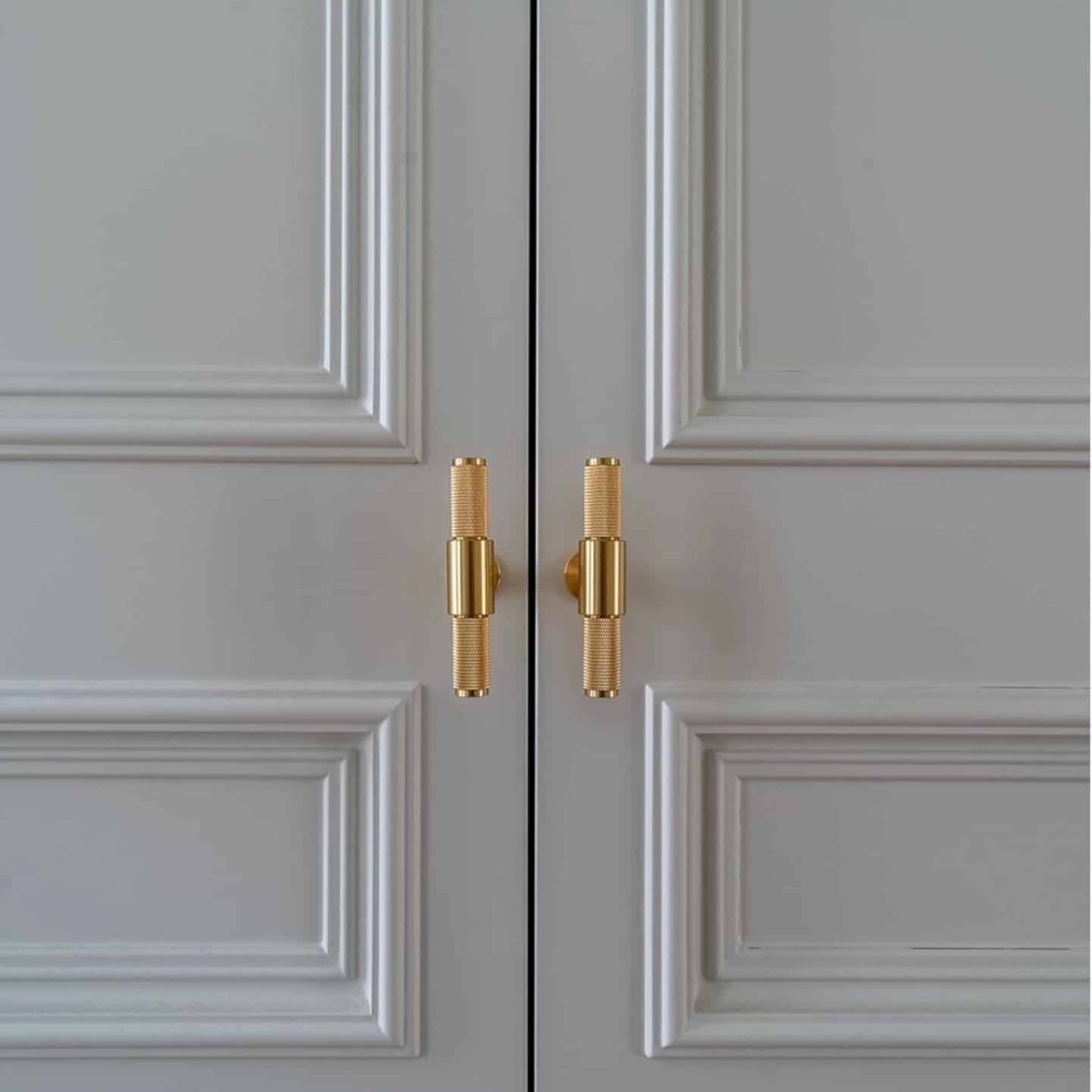 Mr Wardrobe's bespoke white doors with gold handles, handcrafted in London.