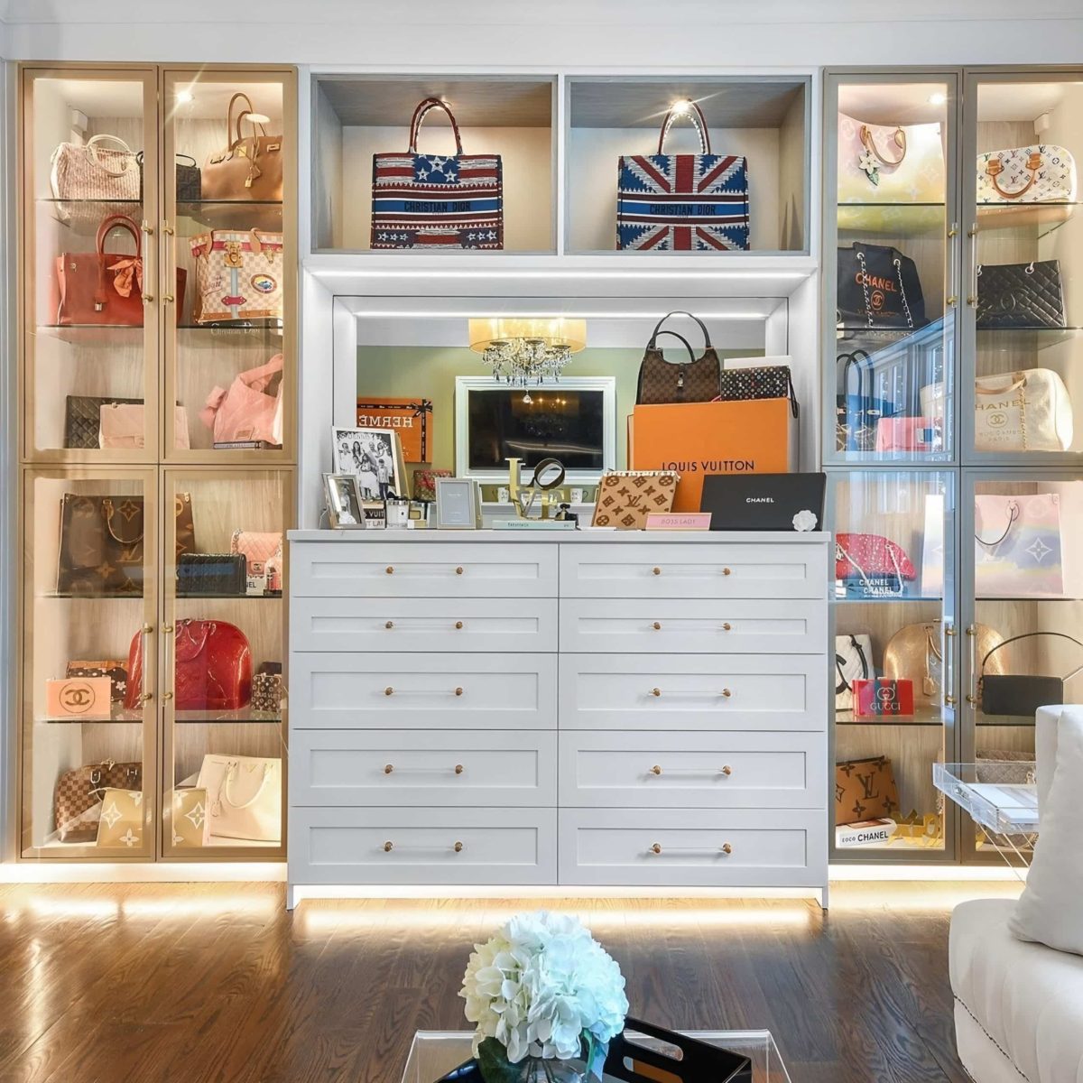 A London living room with a lot of bespoke purses on display, curated by Mr Wardrobe.
